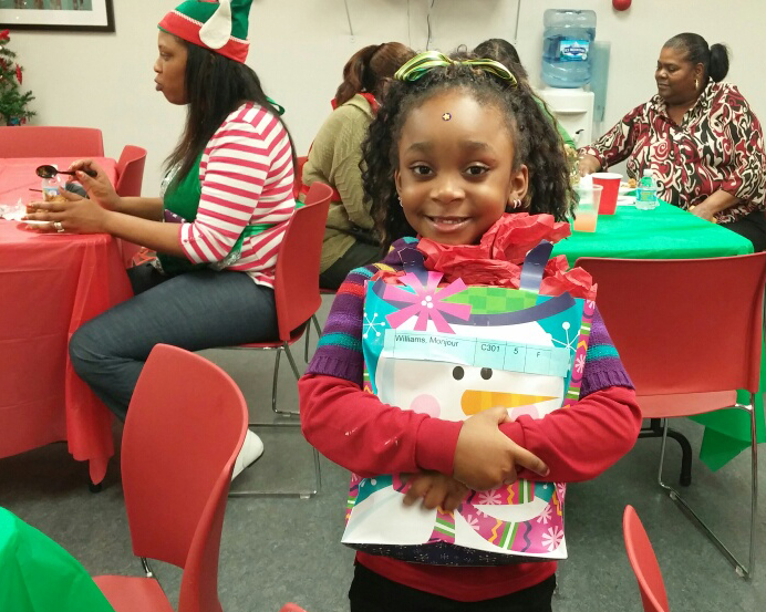 Children receiving holiday gifts at Pullman Wheelworks